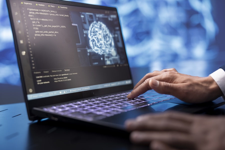 System administrator running AI cognitive computing tech on laptop to simulate computerized model. Close up of notebook used by IT specialist to do data mining with artificial intelligence